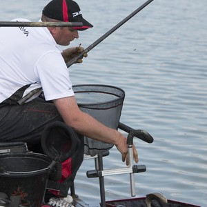 Steve putting a fish in the net 
