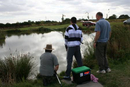 Concentration all round as another small carp is edged towards the waiting net.